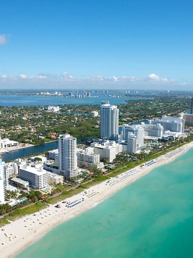 Taking a Leisurely Walk Along the Iconic Ocean Drive in Miami Beach.